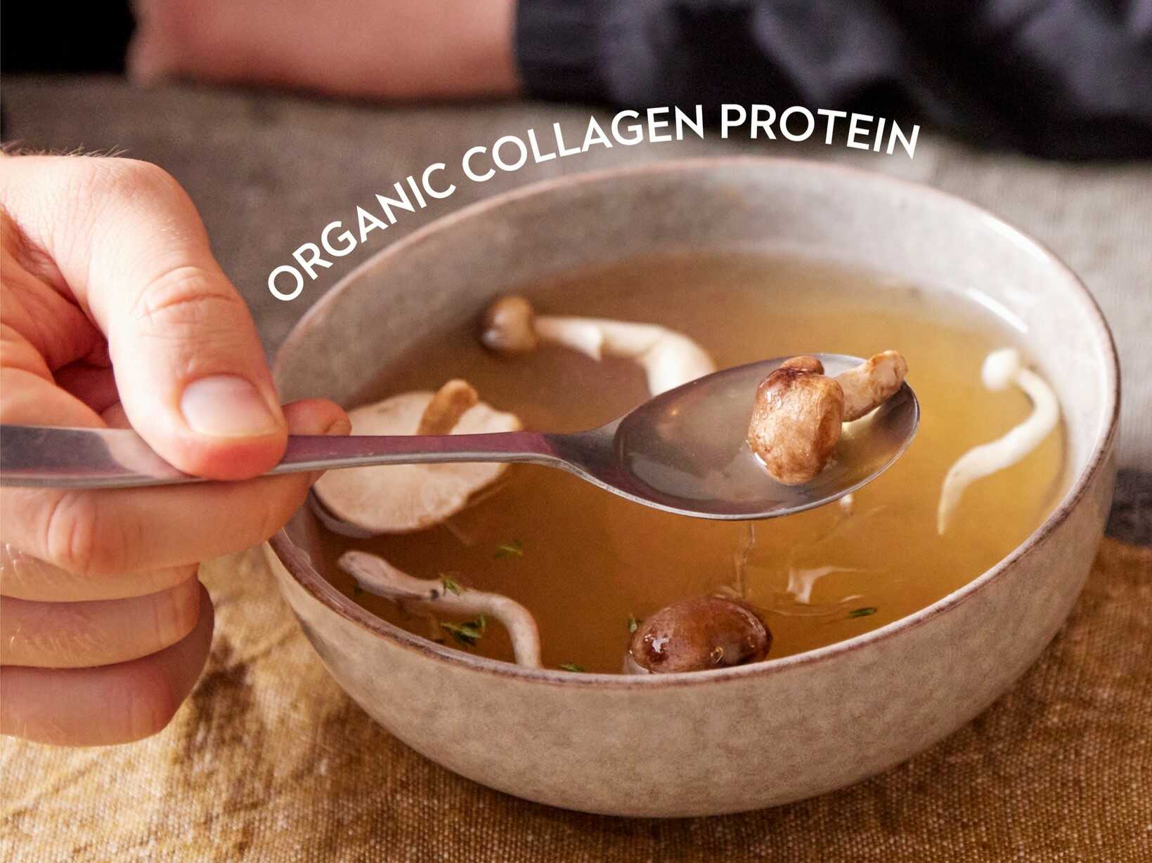 Hand holding a spoonful of mushrooms from a bowl of clear broth, with the words “ORGANIC COLLAGEN PROTEIN” from Planet Paleo curved above the soup.